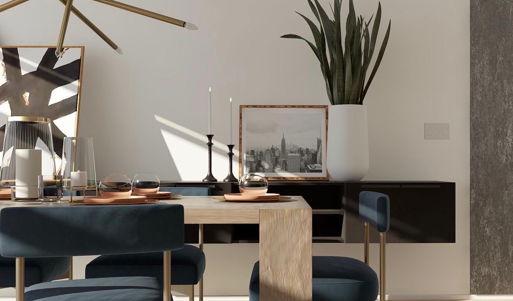 Dining room with dark chairs and framed city skyline art.